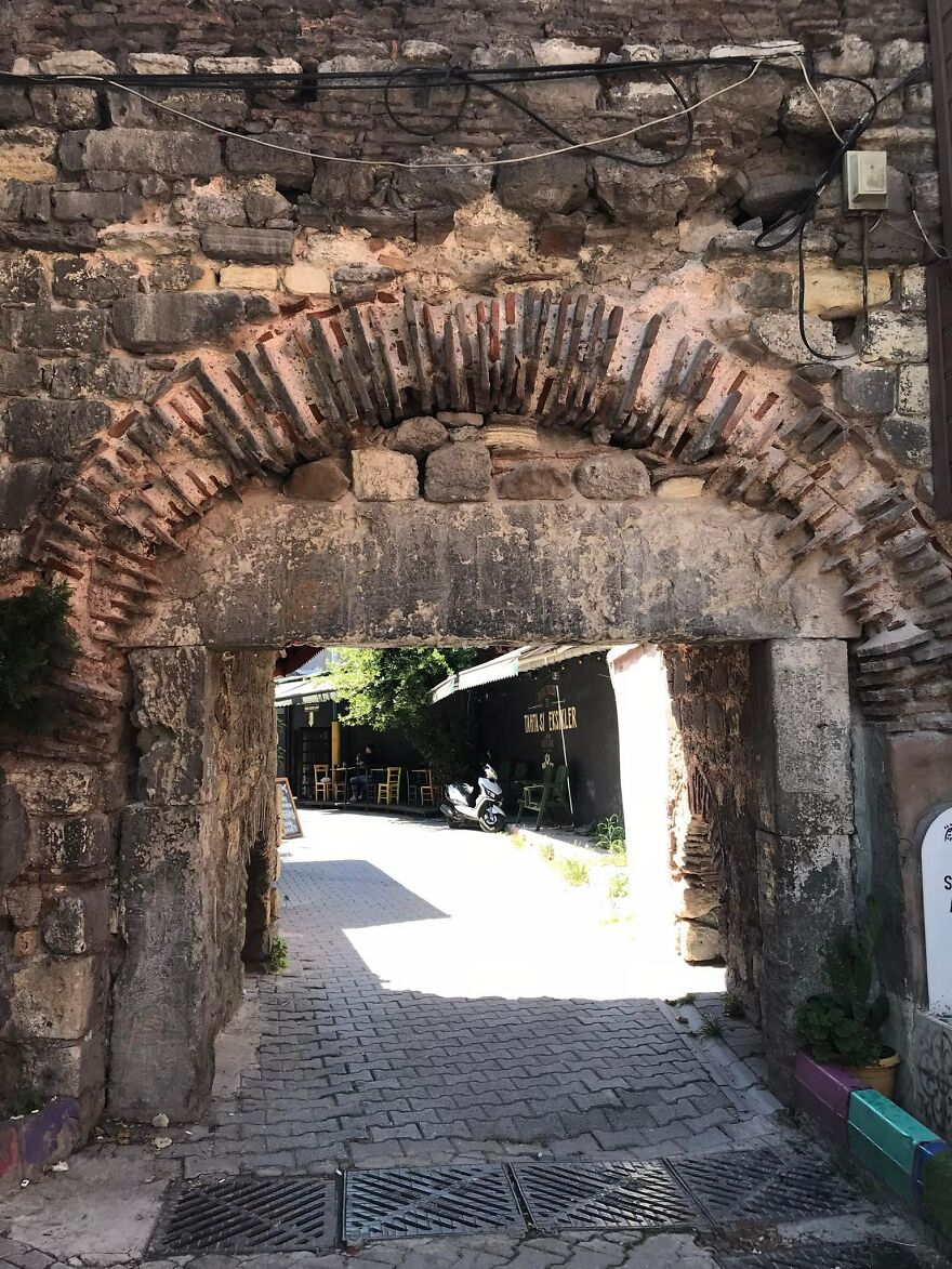 A Medieval Gate Right At The Middle Of The Streets
