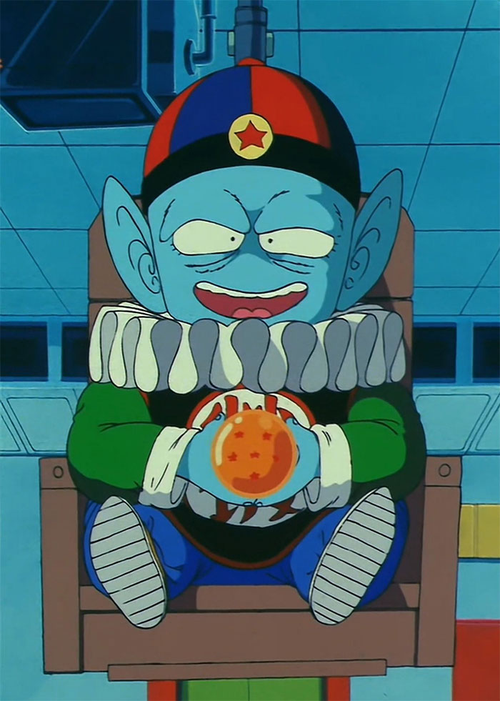 Emperor Pilaf smiling and holding dragon ball