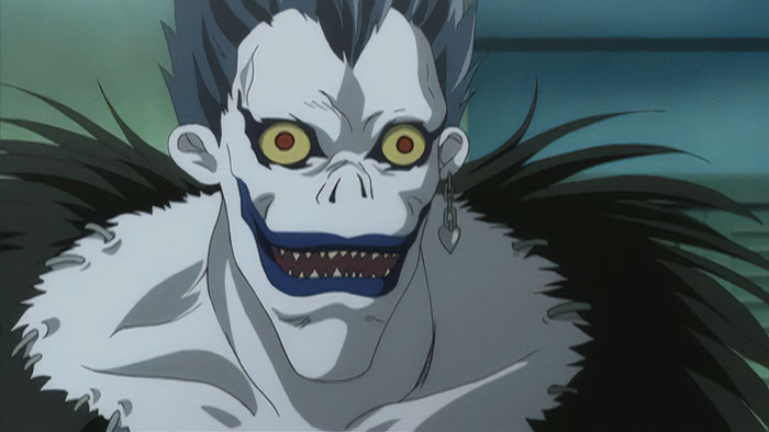Ryuk wearing black clothes and smiling