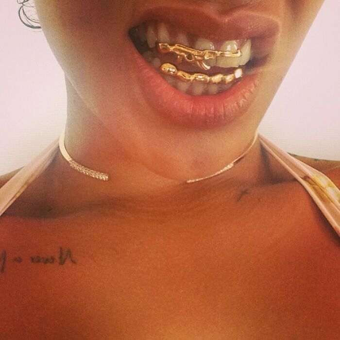 Rihanna With Her Gold Plated Grills