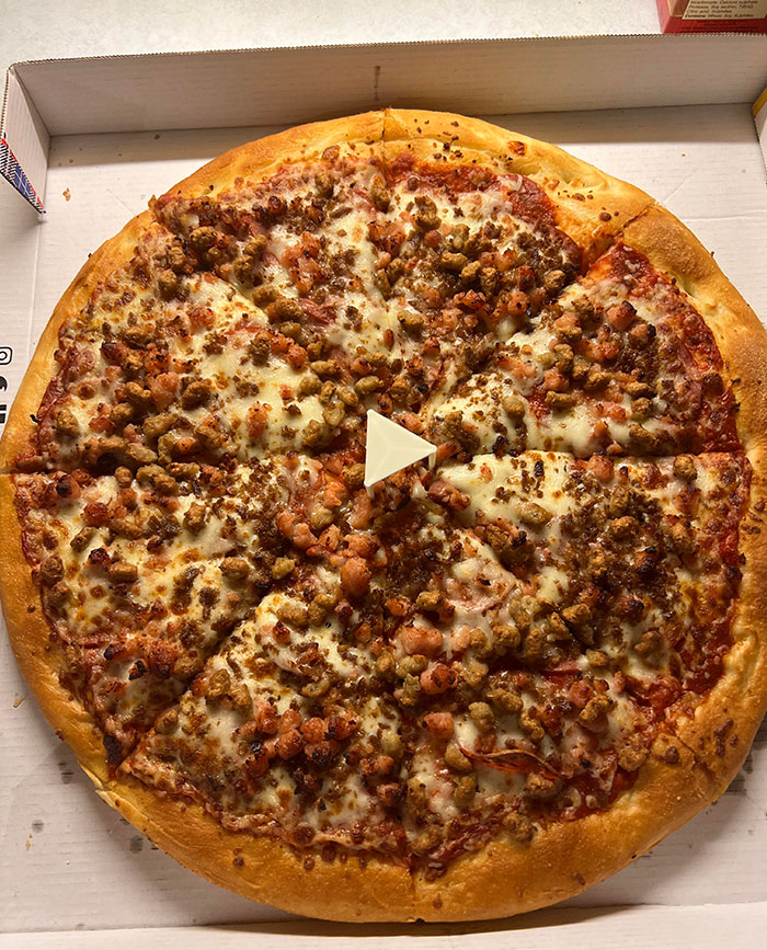 El protector de pizza hace que la foto parezca un video con un botón de reproducción