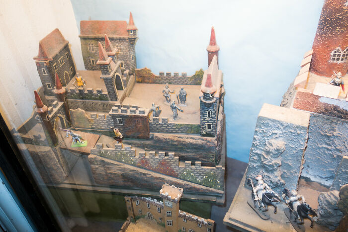 A Castle Set With A Cannon Turret And Plastic Figures