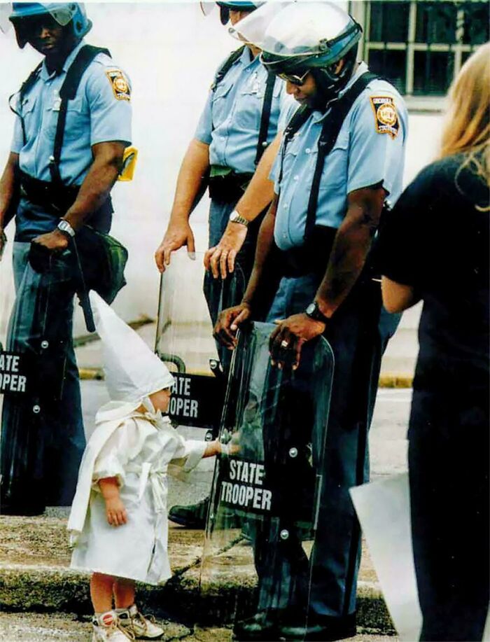 A Ku Klux Klan Child And A Black State Trooper Meet Each Other, At A Klan Rally Protest In Gainesville, GA (1992)