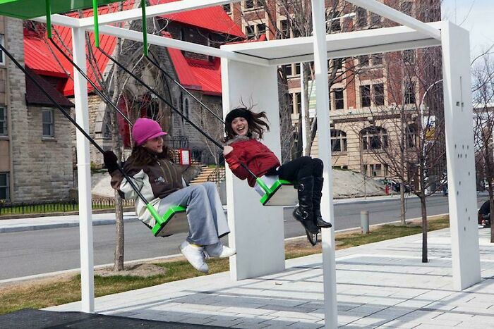 A Bus Stop With Swings