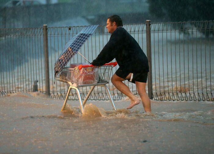 An Australian Man Goes Shopping For Essential Groceries (Beer) During Flooding And Severe Storms
