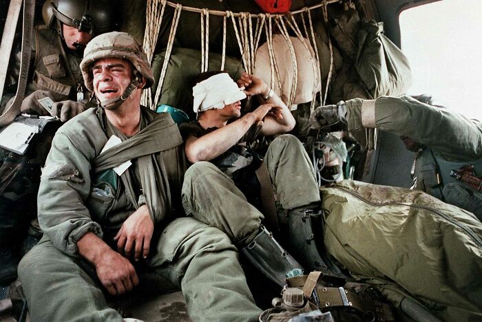 February 27, 1991. Sgt. Ken Kozakiewicz Of The 24th Infantry Division Cries Next To The Body Of His Friend, Pvt. Andy Alaniz, Who Was Killed By Friendly-Fire