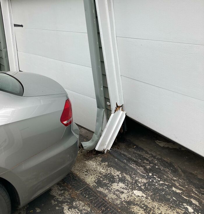 A Week After Installing Our New Garage Door Opener Our Teenager Backs Into Both Garage Doors Completely Dislodging Them And Hitting A Support Beam