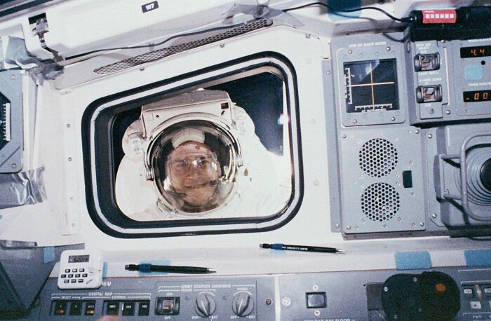 May 12, 1992. Astronaut Rick Hieb Peers Into The Space Deck During An Sts-49 Mission