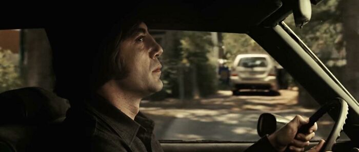In 'No Country For Old Men' (2007), While Anton Chigurh Is Driving In A Neighborhood, A 2004 Subaru Forester Can Be Seen In The Background, Despite The Film Being Set In 1980