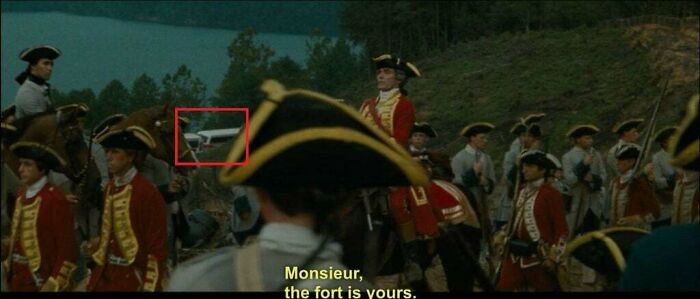 In "The Last Of The Mohicans" When General Monro Surrenders Fort William Henry To The French, Buses Are Visible Parked In The Background