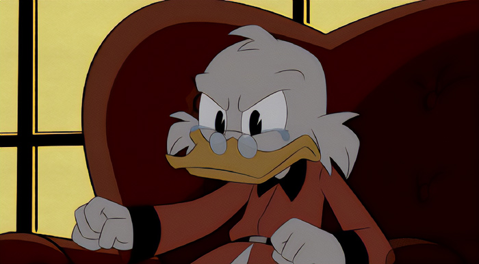DuckTales character Scrooge McDuck is sitting in an armchair