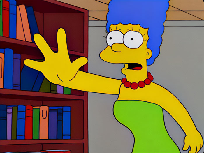 The Simpsons character Marge Simpson indicates to stop