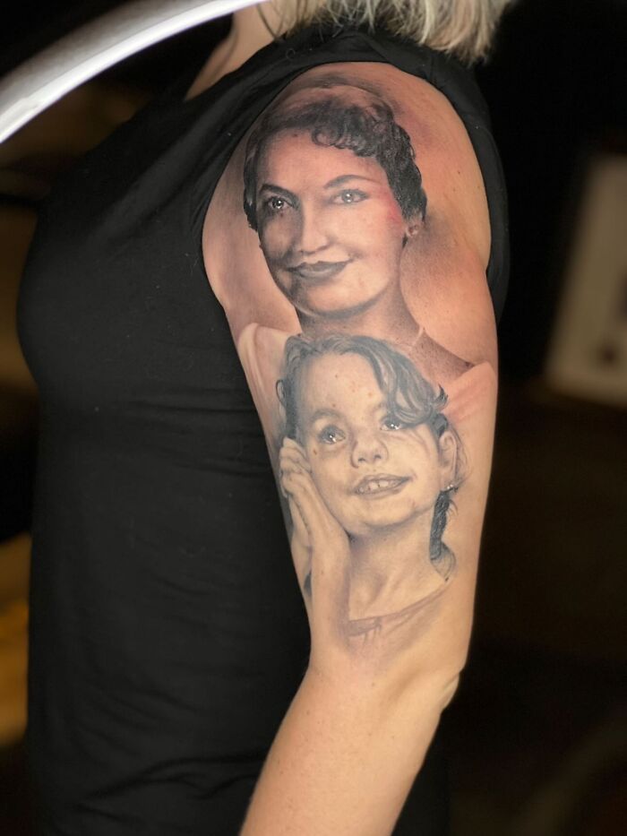 Tattoo portrait of a woman and a child on an upper arm.