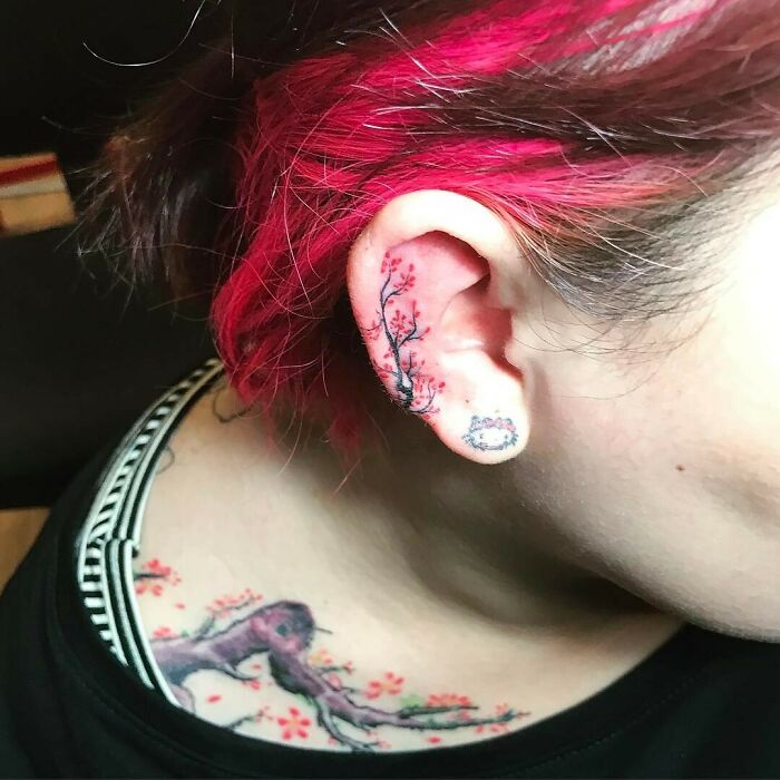 ear tattoo of cherry blossoms