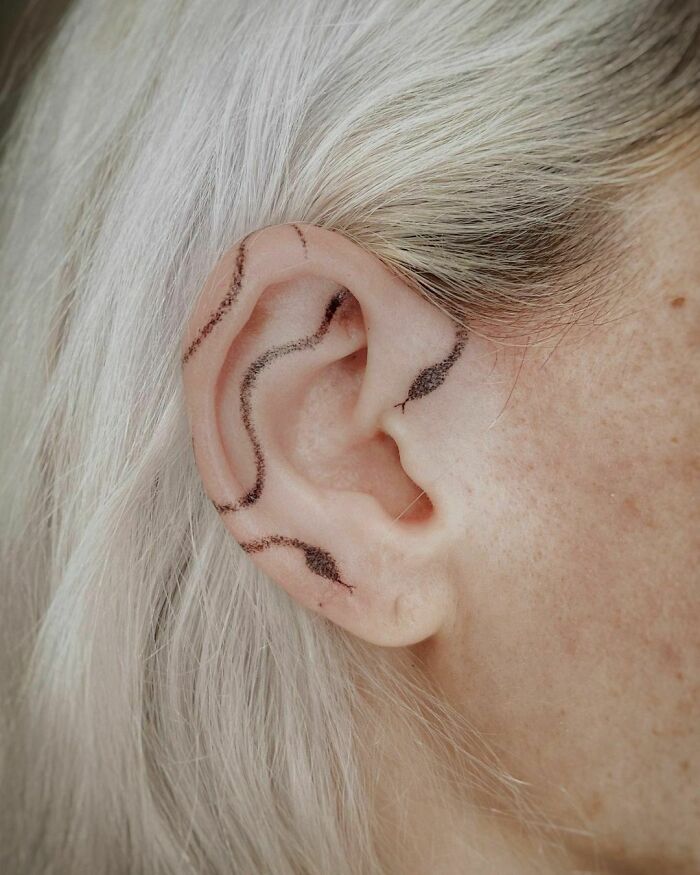 ear tattoo of a snake