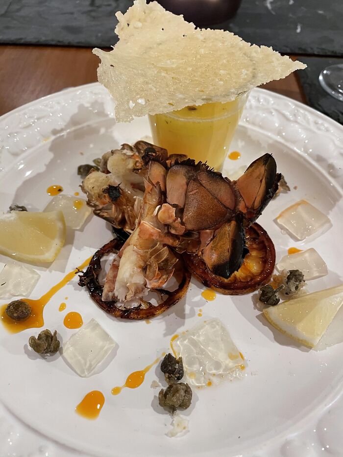 Grilled Lobster, Champagne & Saffron Beurre Blanc, Ginger & Lemongrass Jelly, Caramelised Lemon Slices, Caper Popcorn And A Parmesan Tuile With Chilli Oil