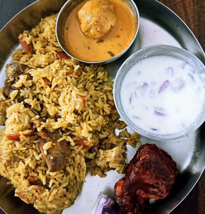 Mutton Pulao, Keema Curry, Fried Chicken With Side Of Yogurt Sauce. Not So Well Plated