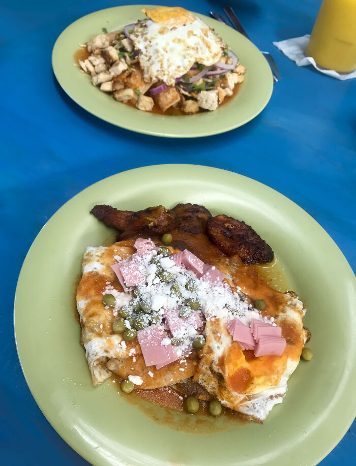 Huevos Motuleños (Front), And Chilaquiles With Fried Egg (Back)