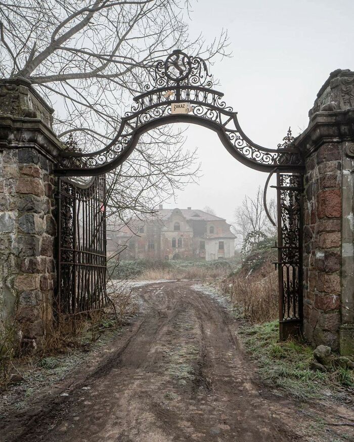 The Entrance Gate To An Abandoned Mansion In Poland