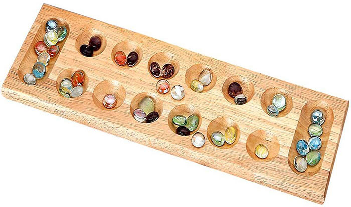 Mancala board with colorful marbles