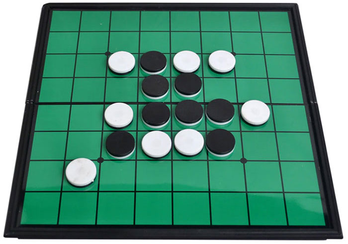 Green board of Reversi game with figures