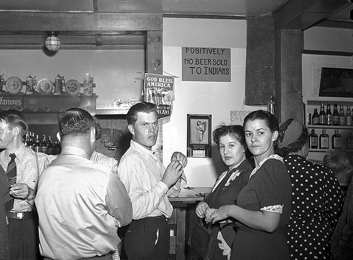 The Bar Has A Sign That Reads "Positively No Beer Sold To Indians" Birney, Montana. August 1941