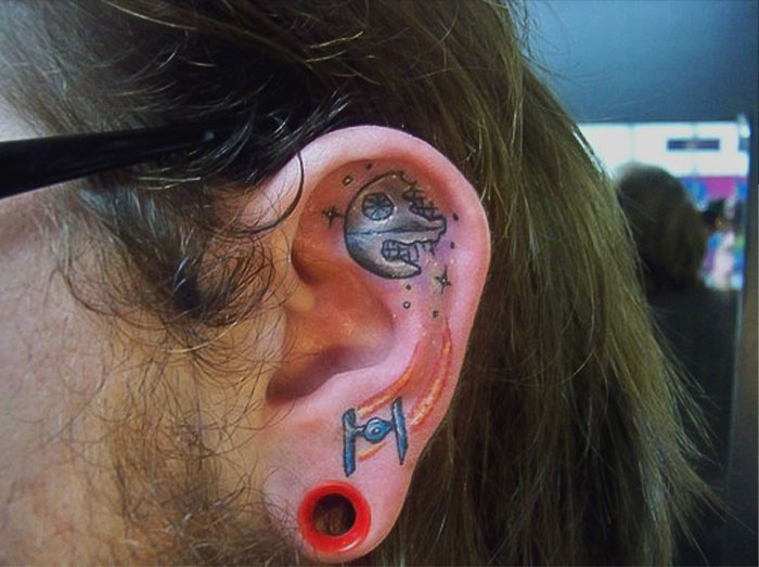 ear tattoo of a death star