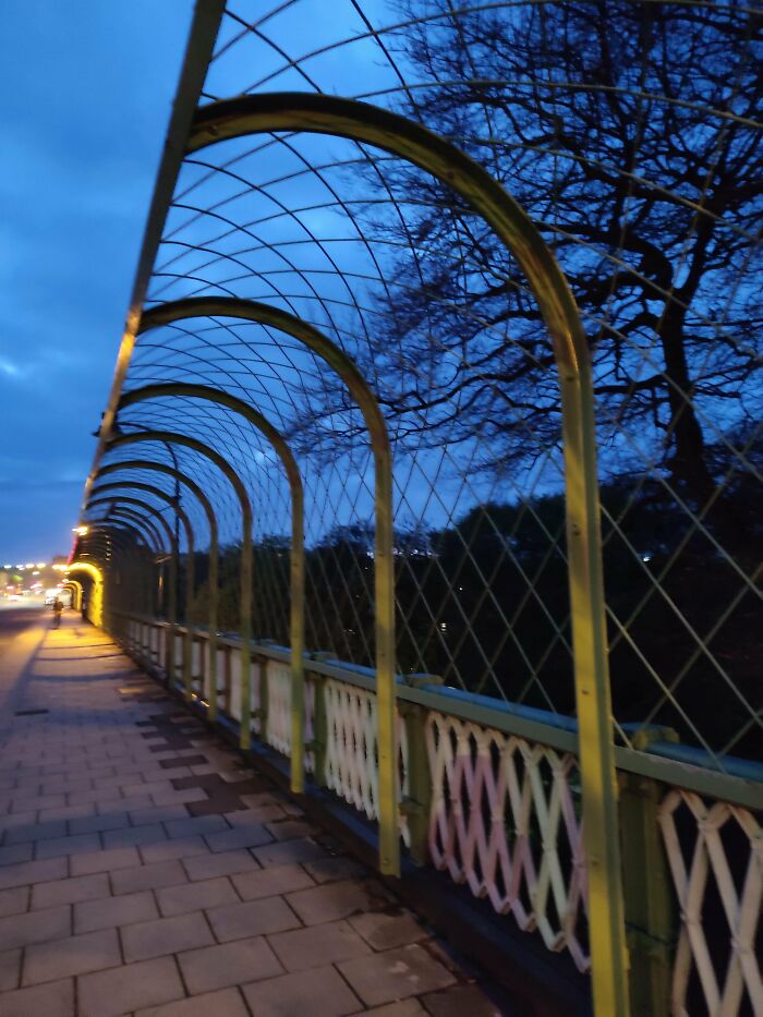 This Anti-Climbing Fence On The" S*icide Bridge "(Colloquially) In A Small Town England. There Are Also Signs With Suicide Hotlines On Them. Not A Fun Part Of Architecture But Definitely Helpful/Saving Lives