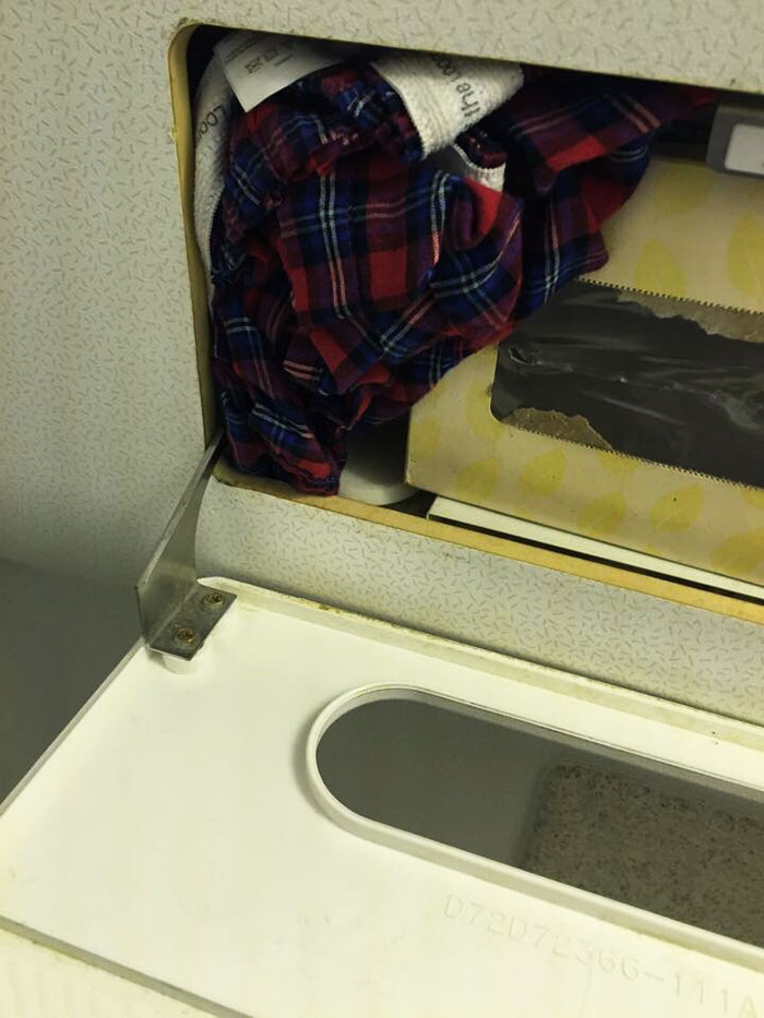 Someone Wedged Their Dirty Underwear Next To The Tissue Dispenser On My Plane
