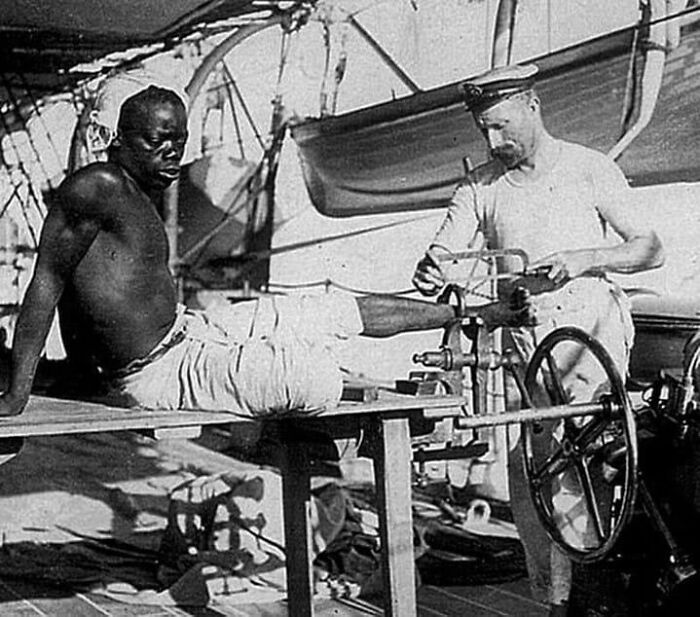 A British Sailor Removing The Leg Chains Off An Enslaved Man Who Had Worn Them For Three Years