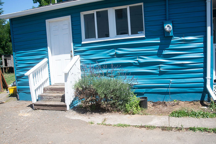 Here's How Hot It Is In Portland Right Now. This Is My Neighbor's House And The Vinyl Siding Is Blistering Off His House Under The Sun In The 108-Degree Heat