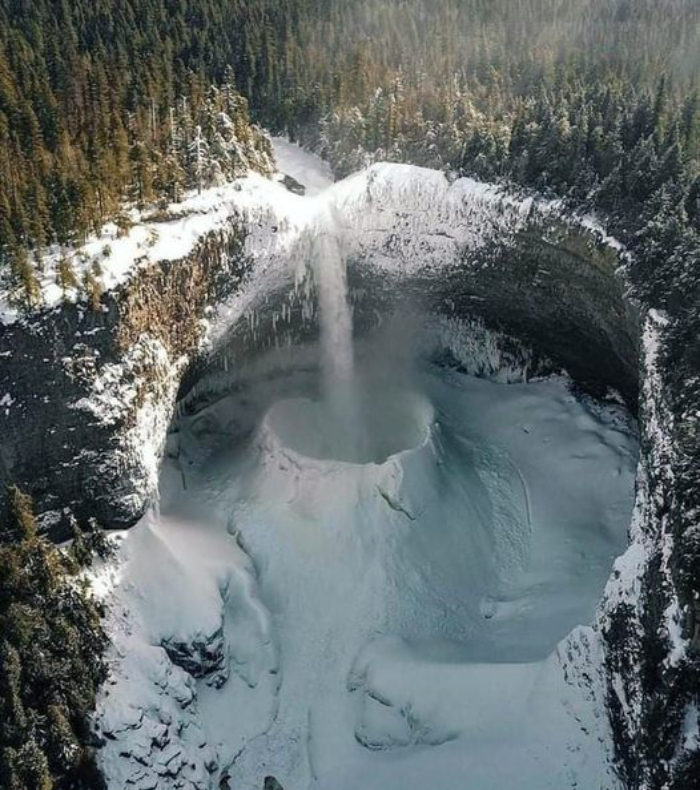 Freezing Temperatures Create The Perfect Environment For Free-Falling Water To Form A Massive "Ice Crater" At The Bottom Of The Falls (B.c.'s Helmcken Falls), British Columbia, Canada