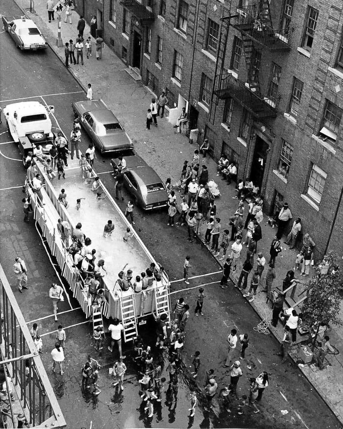 Dozens Of Children And Adults Are Pictured Above Crowded In And Around What Was Called A ‘Swimmobile’ In New York City, Ca. 1970