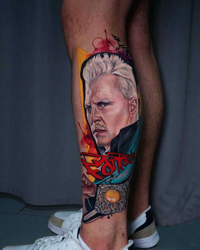 Leg tattoo of a character from the Harry Potter universe, featuring vibrant colors and detailed portraiture.