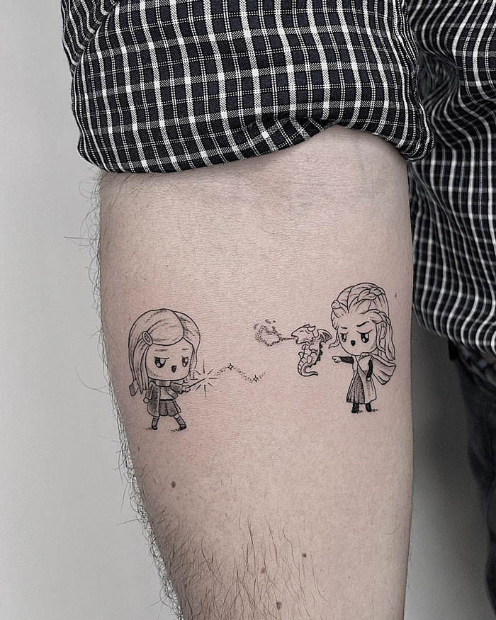 Chibi-style Harry Potter tattoo on arm with wizard duel theme featuring magic spells.