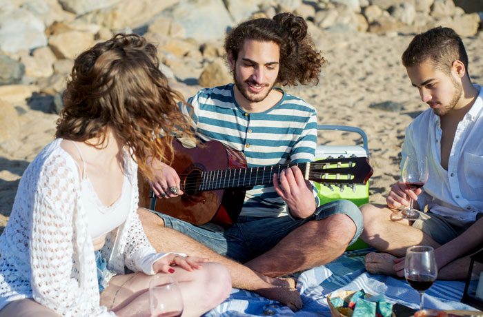 Man playing guitar in the picnic