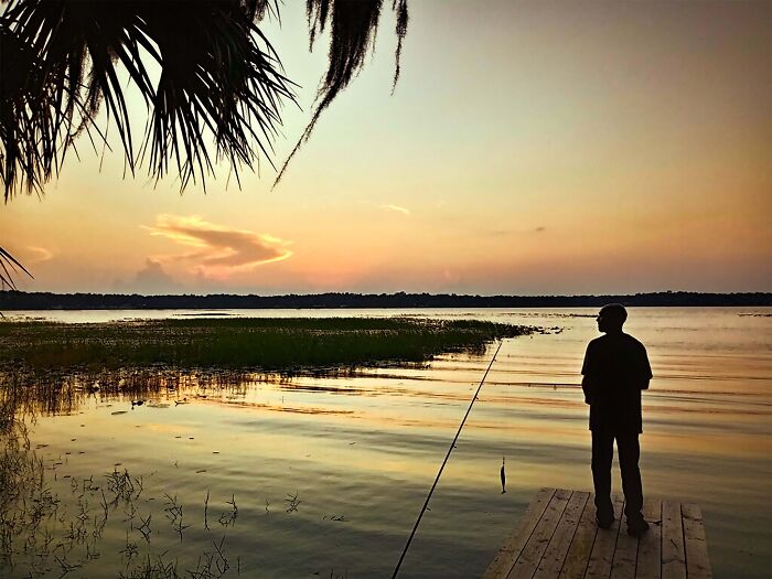 My Husband Fishing Off Of Our Dock On Lake Hernando In Florida