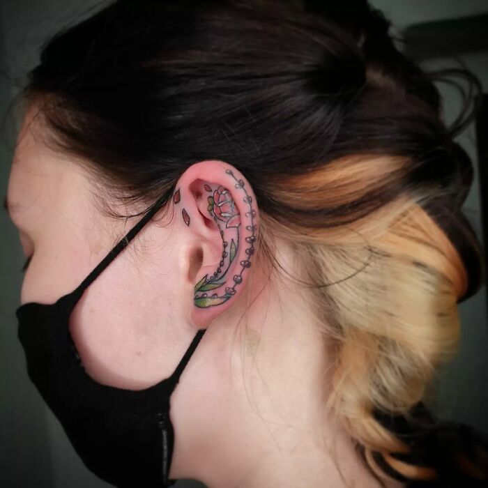 ear tattoo of a flower stalk