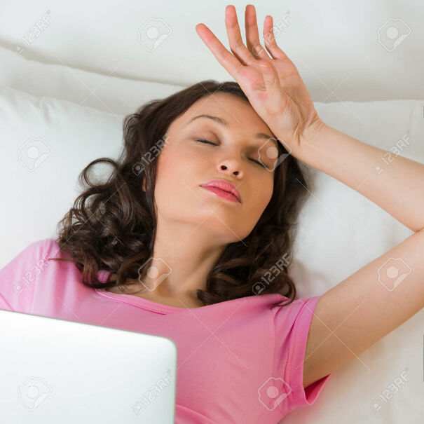 27584886-young-pretty-woman-in-dramatic-pose-with-drama-gesture-laying-on-bed-and-holding-tablet-computer-whi.jpg