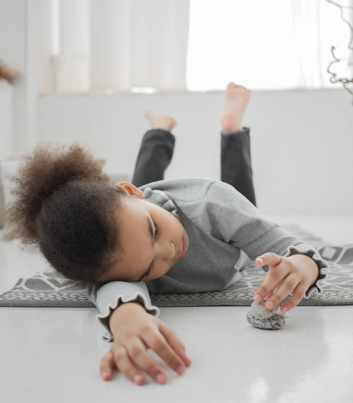 Girl playing with rocks