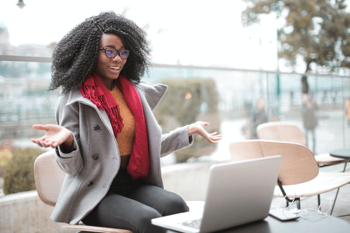 Woman sitting and making gests with arms and talking