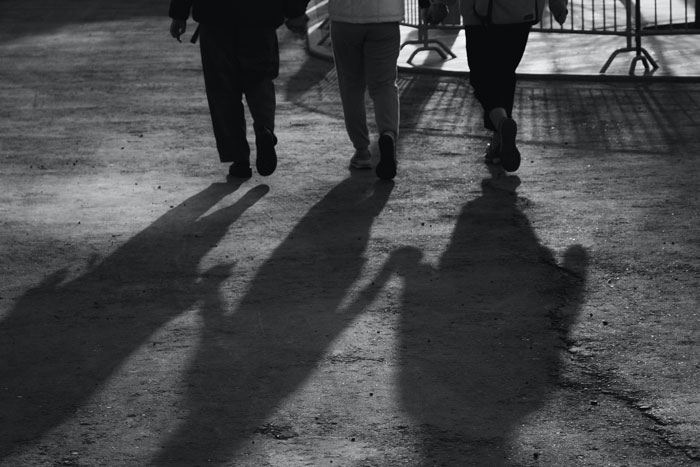 Shadows of walking people