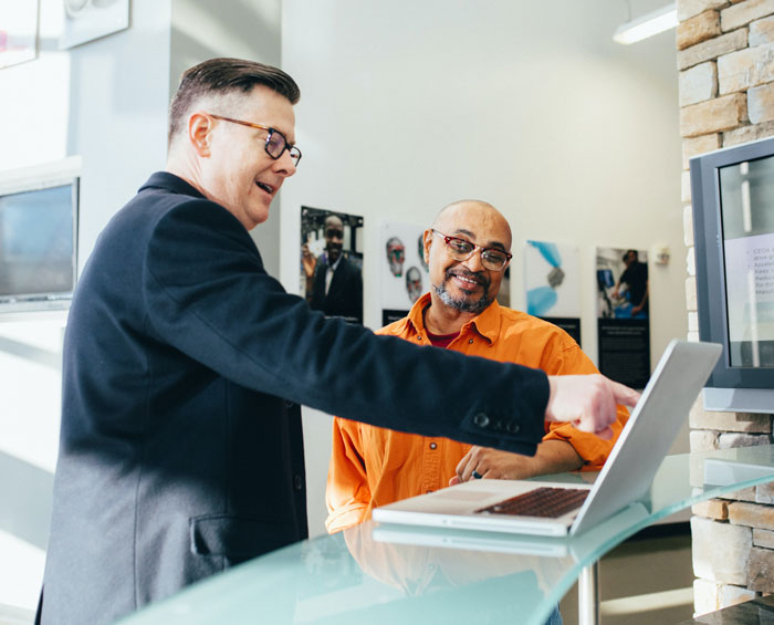 Business mans pointing and smiling