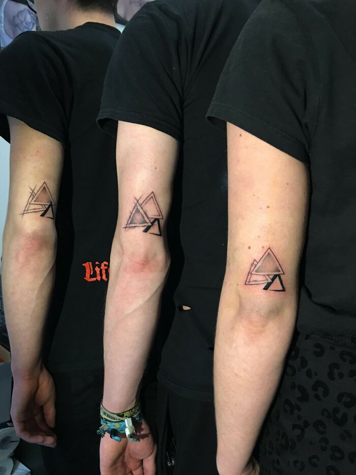Triangles matching elbow tattoos