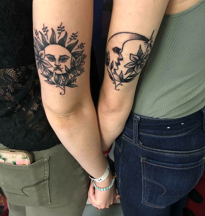 Matching floral sun and moon arm tattoos