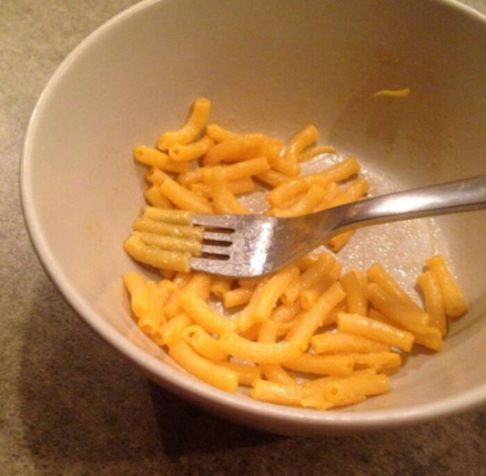 Eating Mac N' Cheese By Arranging A Single Noodle On Each Fork Tine