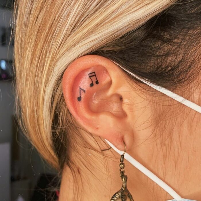 ear tattoo of musical notes