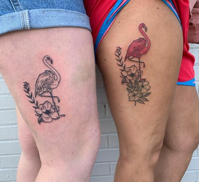 Matching flamingo best friend tattoos on thighs, symbolizing friendship.