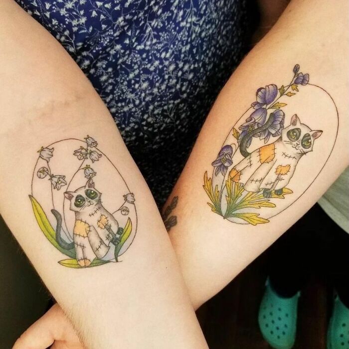Matching floral ghost cat arm tattoos