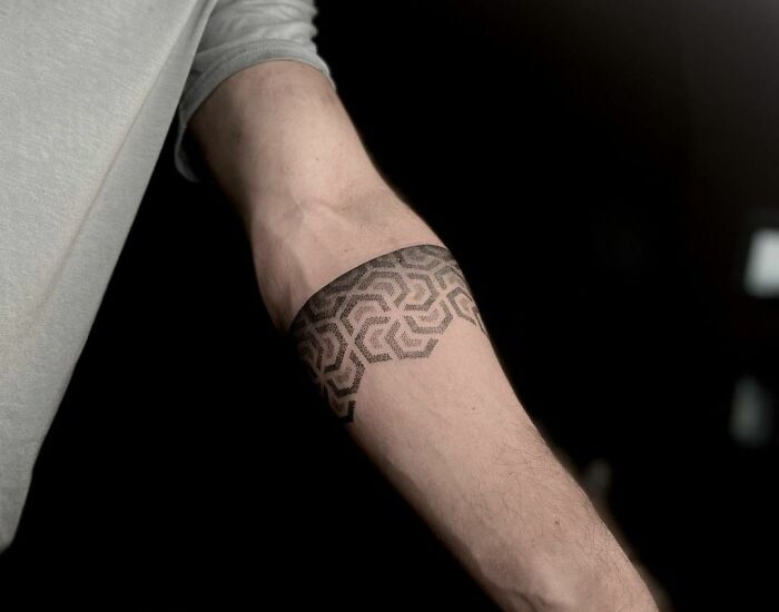 Landscape circle tattoo on the left inner forearm.